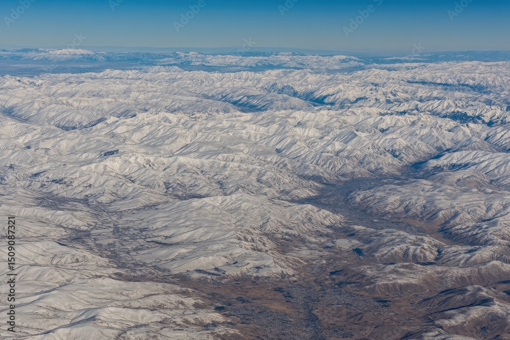 The Wasatch Front Rocky Mountain Range, with its snow-capped peaks in winter, is visible from an airplane, along with the urban cities of Provo, Farmington, Bountiful, Orem, and Salt Lake City The Wasatch Front Rocky Mountain Range, with its snow-capped peaks in winter, is visible from an airplane, along with the urban cities of Provo, Farmington, Bountiful, Orem, and Salt Lake City