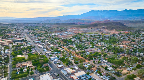 Fototapeta Naklejka Na Ścianę i Meble -  Aerial Small Town Residential Grid and Red Desert Mountains Hurricane Utah