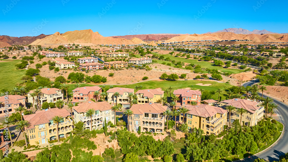 Fototapeta premium Aerial Luxury Golf Villas Palm Trees Desert Community Fly Through