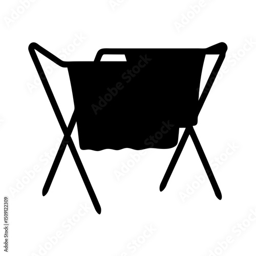 Silhouette of a clothes drying rack with a towel hanging on it
