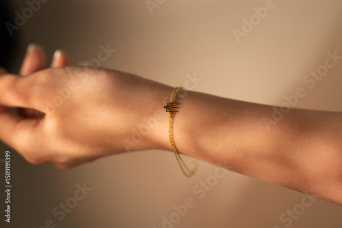 silver bracelet with ornament on hand