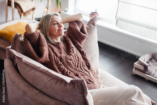 Happy middle aged Woman relaxing at home