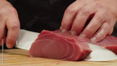 Tuna fillet on cutting board. Cutting fish