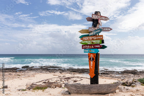 Fototapeta Naklejka Na Ścianę i Meble -  Directional signpost with distances to global destinations in Cozumel