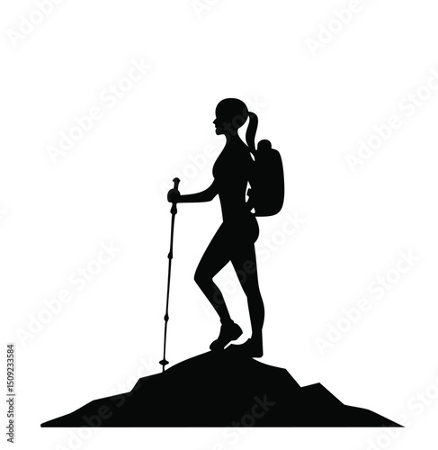 Woman hiker silhouette on mountain peak with backpack and trekking pole