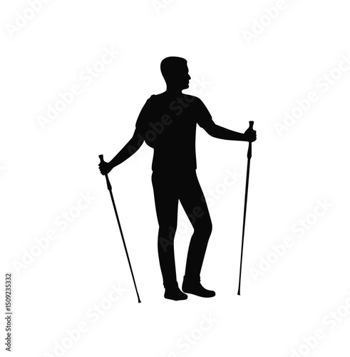 Silhouette of a hiker with backpack and trekking poles