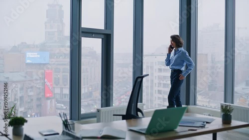 Wallpaper Mural Stylish executive talking mobile phone by office panoramic window. Woman calling Torontodigital.ca