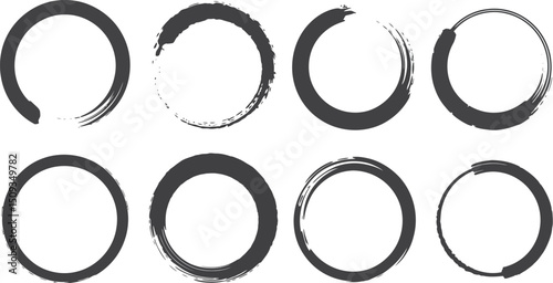 Eight zen circles painted with brushstrokes in black ink on a white background arranged in two rows