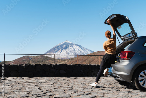 Woman traveling by car in area Mount Teide, El Teide National Park, Tenerife, Canary Islands, Spain.