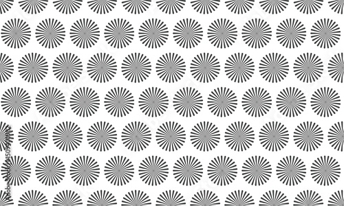 Abstract grayscale pattern featuring repeating circular sunburst motifs.  Ideal for backgrounds, website design, textiles, or any project needing a subtle yet visually engaging texture.