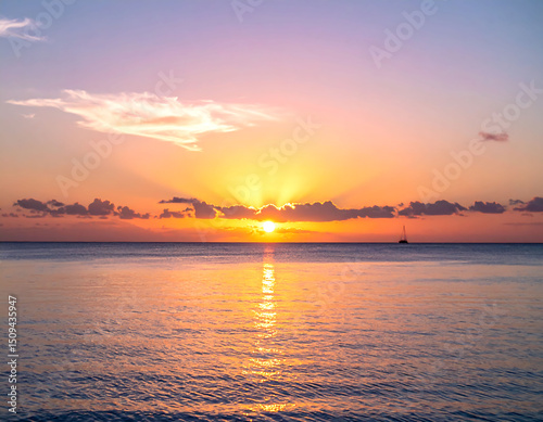 A serene seascape captures a tranquil sunset over the ocean. The suns rays pierce through soft clouds, reflecting golden light onto the gentle waves. Sailboat silhouette adds a touch of adventure.