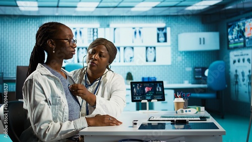 Photography General practitioner uses a stethoscope to consult patient with illness, ensuring normal function of lungs and heartbeat