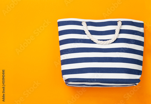 Blue beach bag on color background, top view