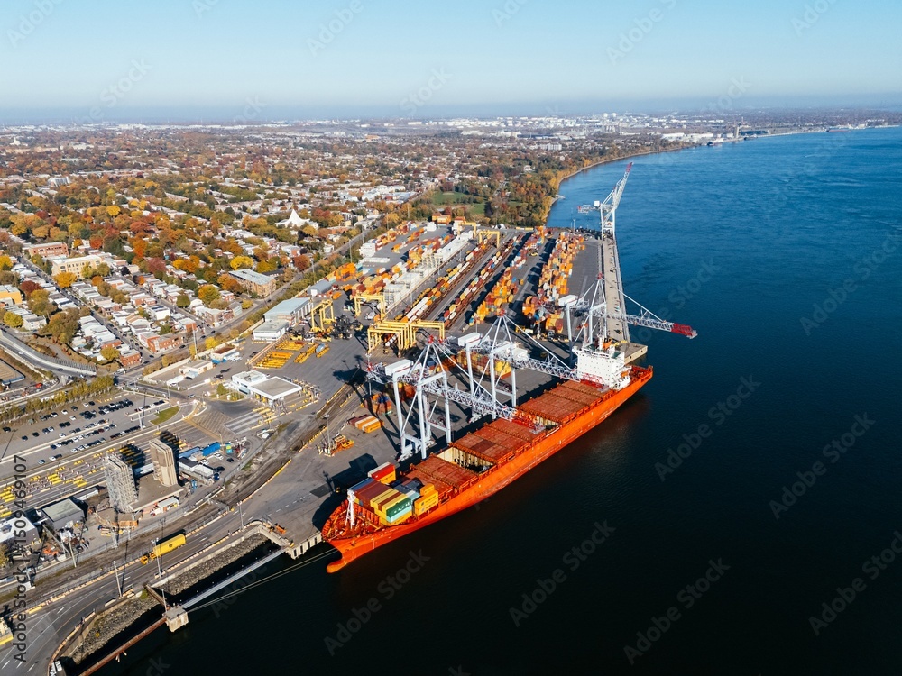 Obraz premium Ship is in the dock, container port. Montreal, Quebec, Canada.