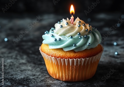 Birthday cupcake with candle and frosting photo