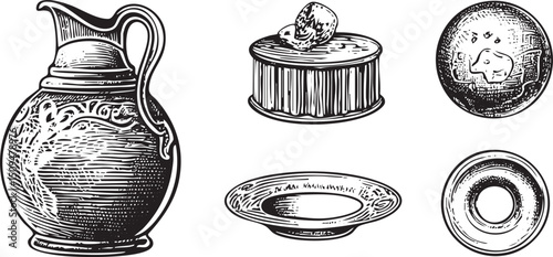 Antique silverware rests on a white surface.