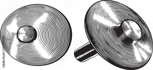 Two circular metal discs are shown in a black and white .