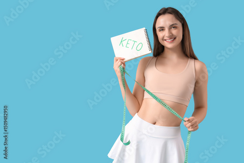 Young woman holding noteboo...