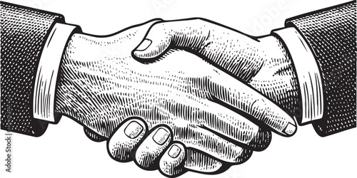 Two hands shake firmly in a business agreement.