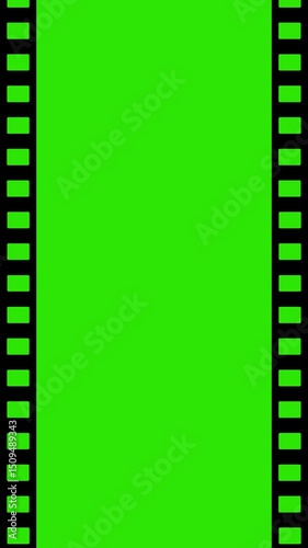 Vintage old  film on green screen. Loopable vertical video.