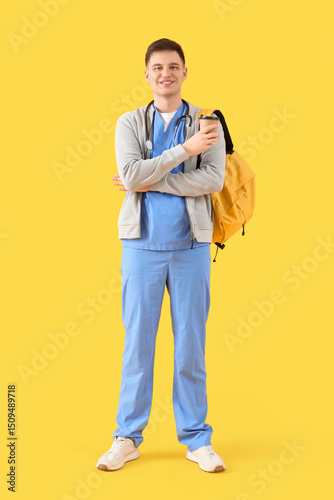 Male medical intern with ba...