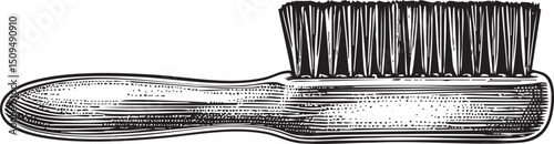 vintage grooming brush rests on a smooth polished surface.