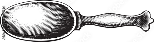 vintage silver spoon rests on a white surface.