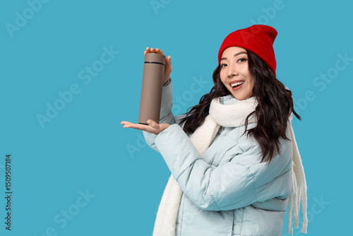 Young Asian woman in winter...