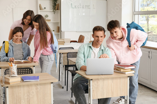 Male students studying with...