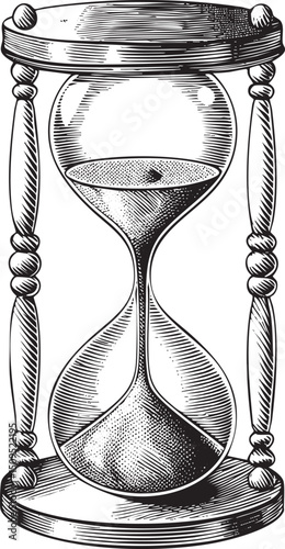 vintage hourglass displays a cascade of dark sand flowing through its narrow neck.