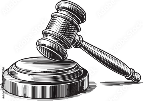 weathered gavel rests on a wooden block ready for use.