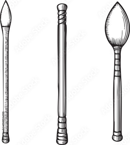Three distinct elongated tools stand upright in a linear arrangement.