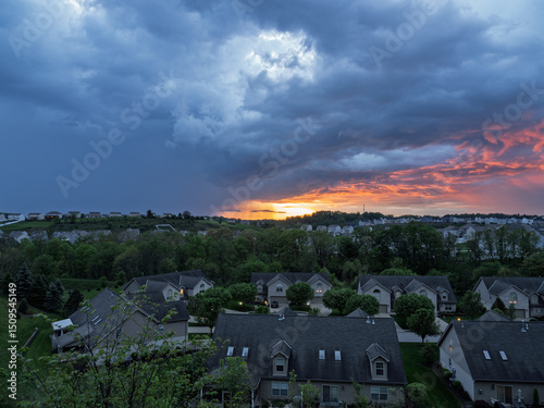Wide view of stormy sunset sky over a residential neighborhood near Pittsburgh