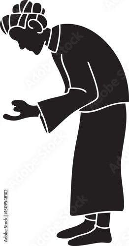 silhouette of an elderly person kneels in a contemplative pose.