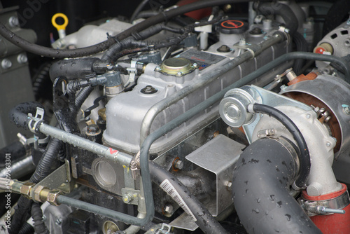 A detailed and intricate view of a highperformance engine that showcases various critical components involved