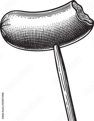 dark sausage is impaled on a slender wooden stick.