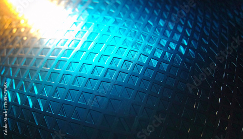 Blue Metal Grid Texture: Abstract close-up shot of a blue metal surface with a geometric grid pattern, illuminated by a warm light source. The texture is smooth yet intricate.