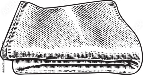 folded towel rests on a surface.