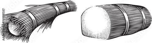 Two bundles of hay are stacked vertically one partially unrolled.
