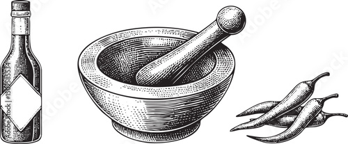wooden mortar and pestle rest beside a bottle of spice and several chili peppers.