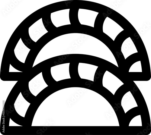 Two dumplings sit stacked on top of each other, ready to be cooked and enjoyed in a simple, minimalist style, creating a clean and appetizing image.