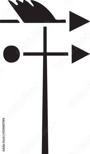 black wind vane stands vertically atop a wooden .