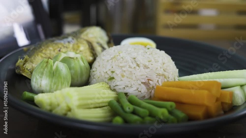 Thai Shrimp Paste Fried Rice With Mackerel On Table, Video footage for documentary and cinematic in food scene.