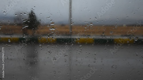 
Rainy Car Window Abstract Footage – Moving Traffic Seen Through Raindrop-Covered Glass with Ambient Sound
