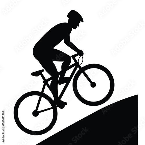Silhouette of cyclist riding uphill