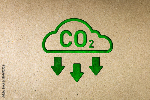 Green co2 reduction symbol on paper. Concept of carbon reduction campaign, zero greenhouse gas emissions, environmental protection, sustainable development. with copy space