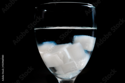Nata de Coco Cubes in a Glass with Black Background