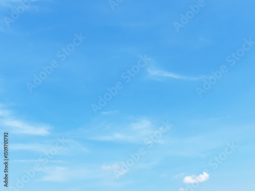 Blue sky background and white clouds soft focus, and empty space, horizontal shape.