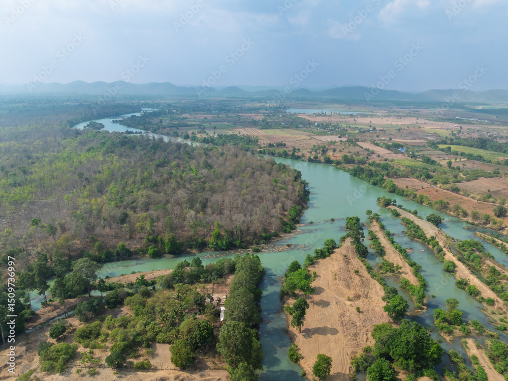 Naklejka premium Scenic aerial view of Buon Don district in Dak Lak province, Vietnam showcasing winding rivers and lush green landscapes