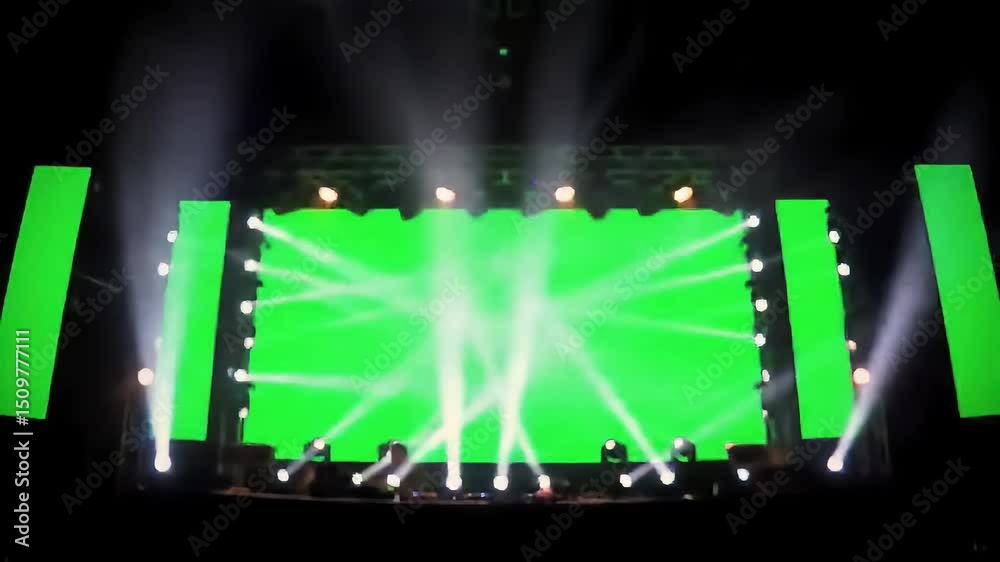 DJ stage lights on green screen background, Light beams,spotlights on stage chroma key. 4k video effect copy space
